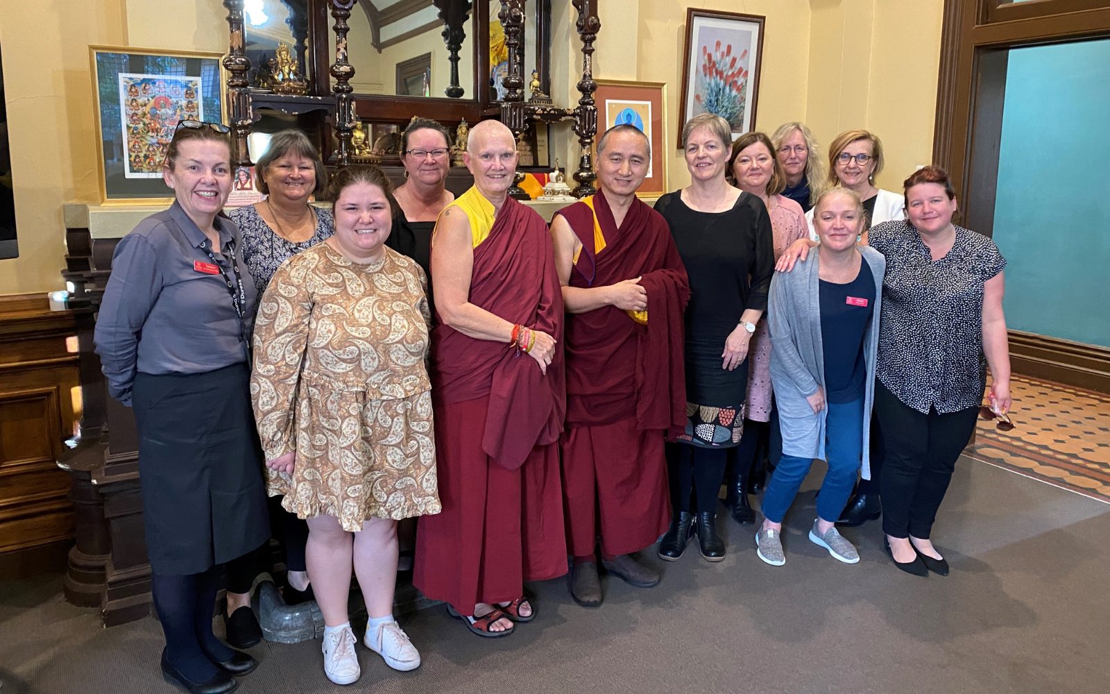 Geshe Tenzin Zopa with staff at Karuna